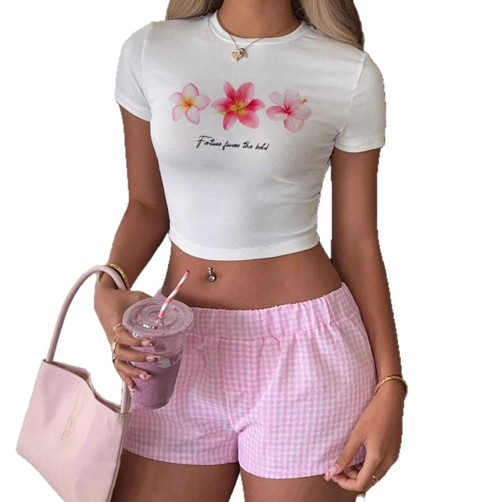 Damen Crop-Top med blommönster och inspirerande text Mirla-Eva Jonsson