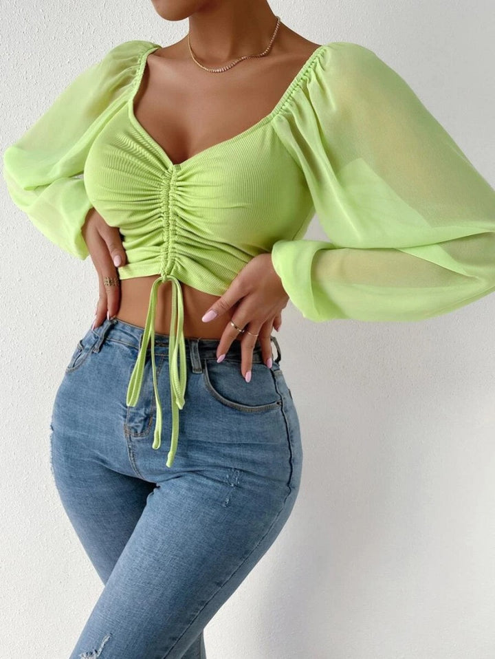 Damen Crop-Top med strukturerad kropp och eleganta puffärmar Mirla-Eva Jonsson