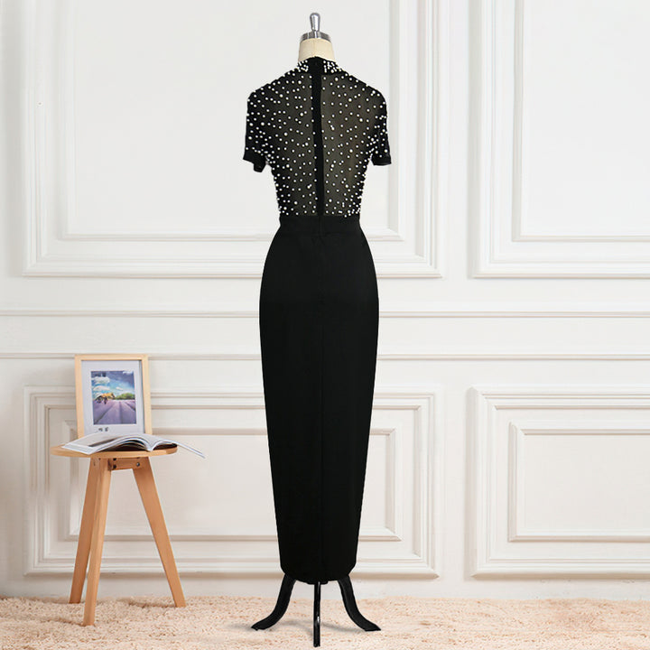 Damen Elegant klänning med transparenta puffärmar och pärldetaljer Mirla-Eva Jonsson