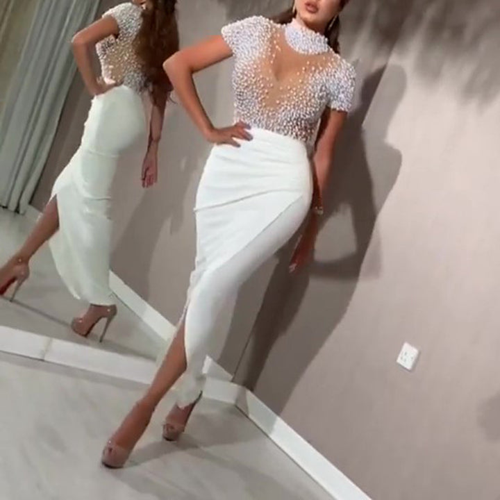 Damen Elegant klänning med transparenta puffärmar och pärldetaljer Mirla-Eva Jonsson