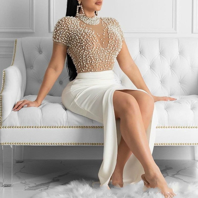 Damen Elegant klänning med transparenta puffärmar och pärldetaljer Mirla-Eva Jonsson