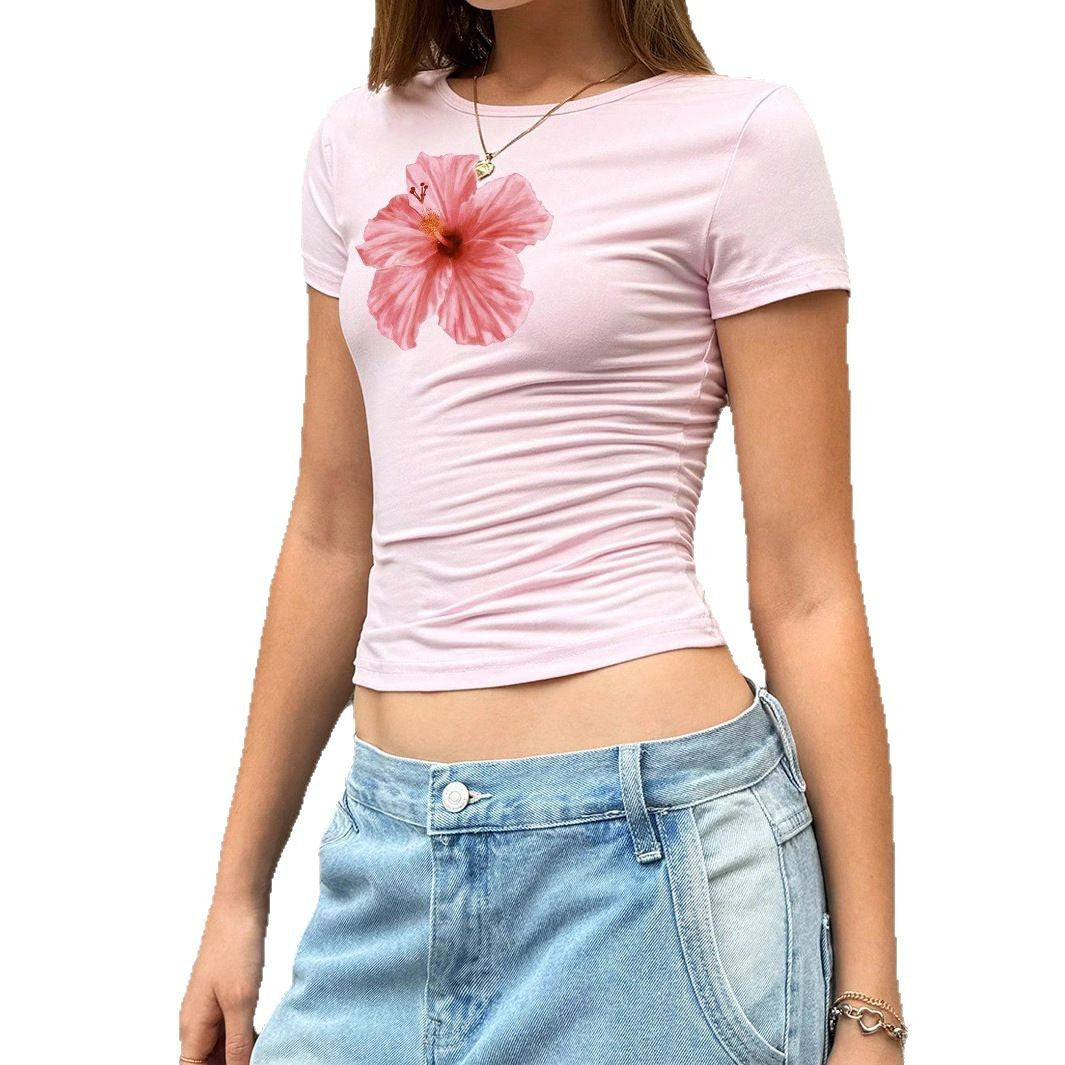 Damen Figurbetontes Kurzarmshirt mit lebhaftem Hibiskus-Motiv Mirla-Eva Jonsson