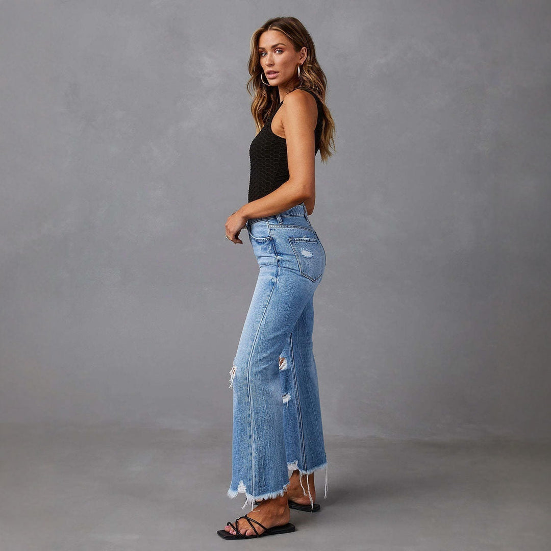 Damen Flared Jeans med stiliga slitdetaljer och fransade fållar Mirla-Eva Jonsson