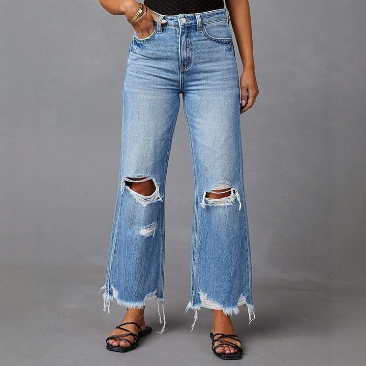 Damen Flared Jeans med stiliga slitdetaljer och fransade fållar Mirla-Eva Jonsson