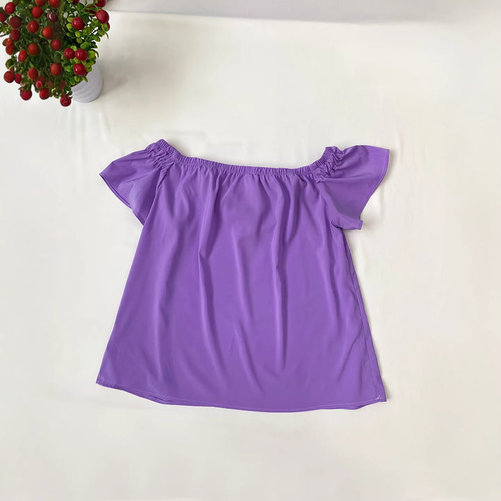 Damen Lekker topp med off-shoulder detaljer og rufselementer Mirla-Eva Jonsson