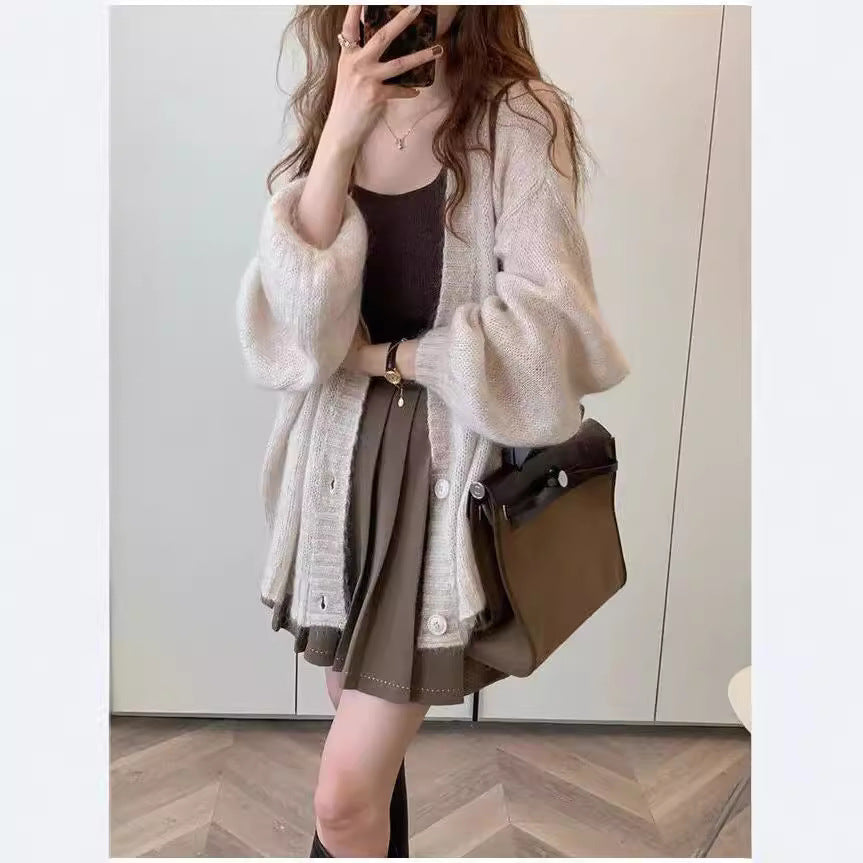 Damen Strickjacke im lässigen Oversized-Stil mit voluminösen Ärmeln und praktischen Taschen Mirla-Eva Jonsson