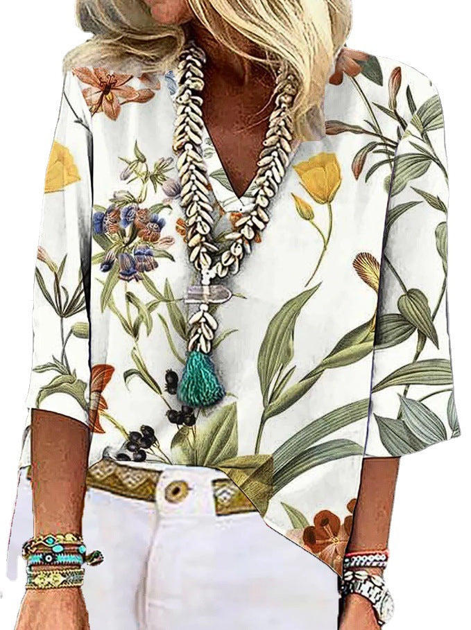 Damen V-nack blus med blommönster och praktiska fickor Mirla-Eva Jonsson