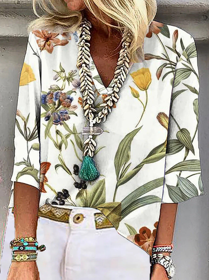 Damen V-nack blus med blommönster och praktiska fickor Mirla-Eva Jonsson