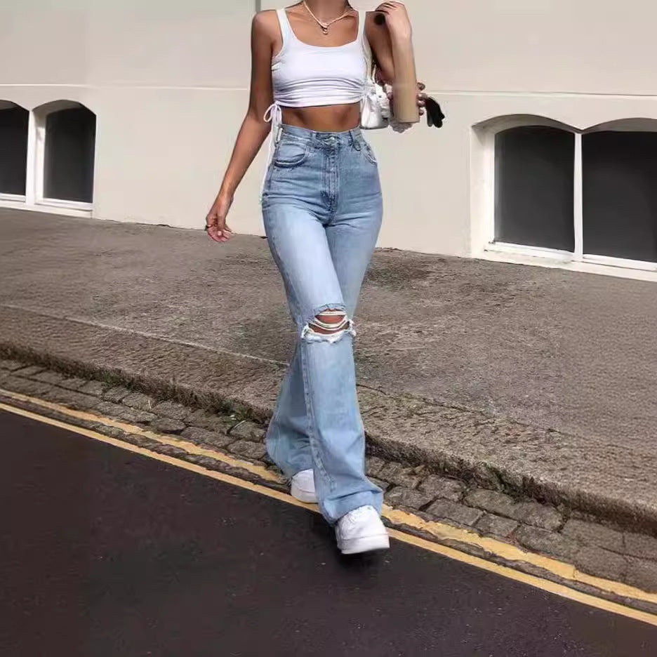 Damen Vintage Schlagjeans med moderiktiga slitdetaljer och hög midja Mirla-Eva Jonsson
