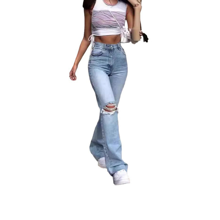 Damen Vintage Schlagjeans med moderiktiga slitdetaljer och hög midja Mirla-Eva Jonsson