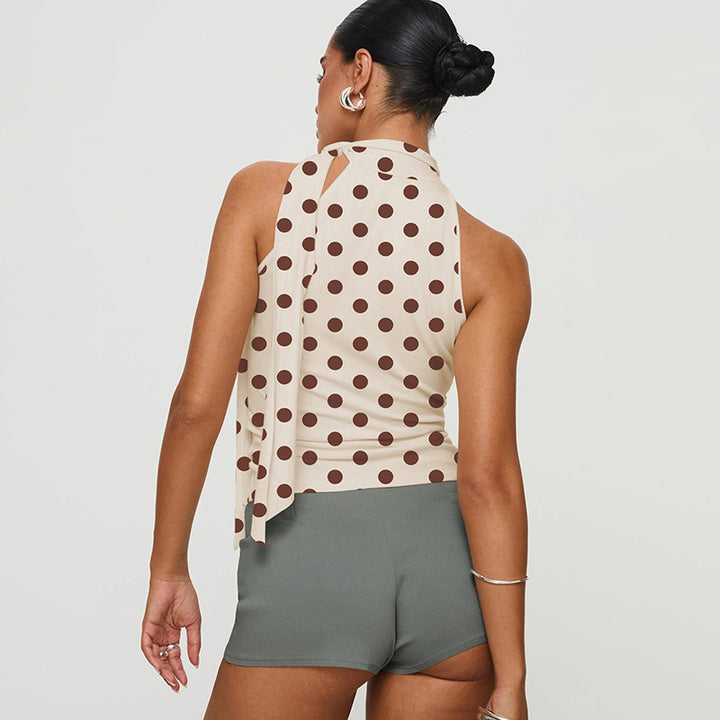 Damen asymmetrisk polka prick topp med höga skärlinjer och elegant halterdesign Mirla-Eva Jonsson