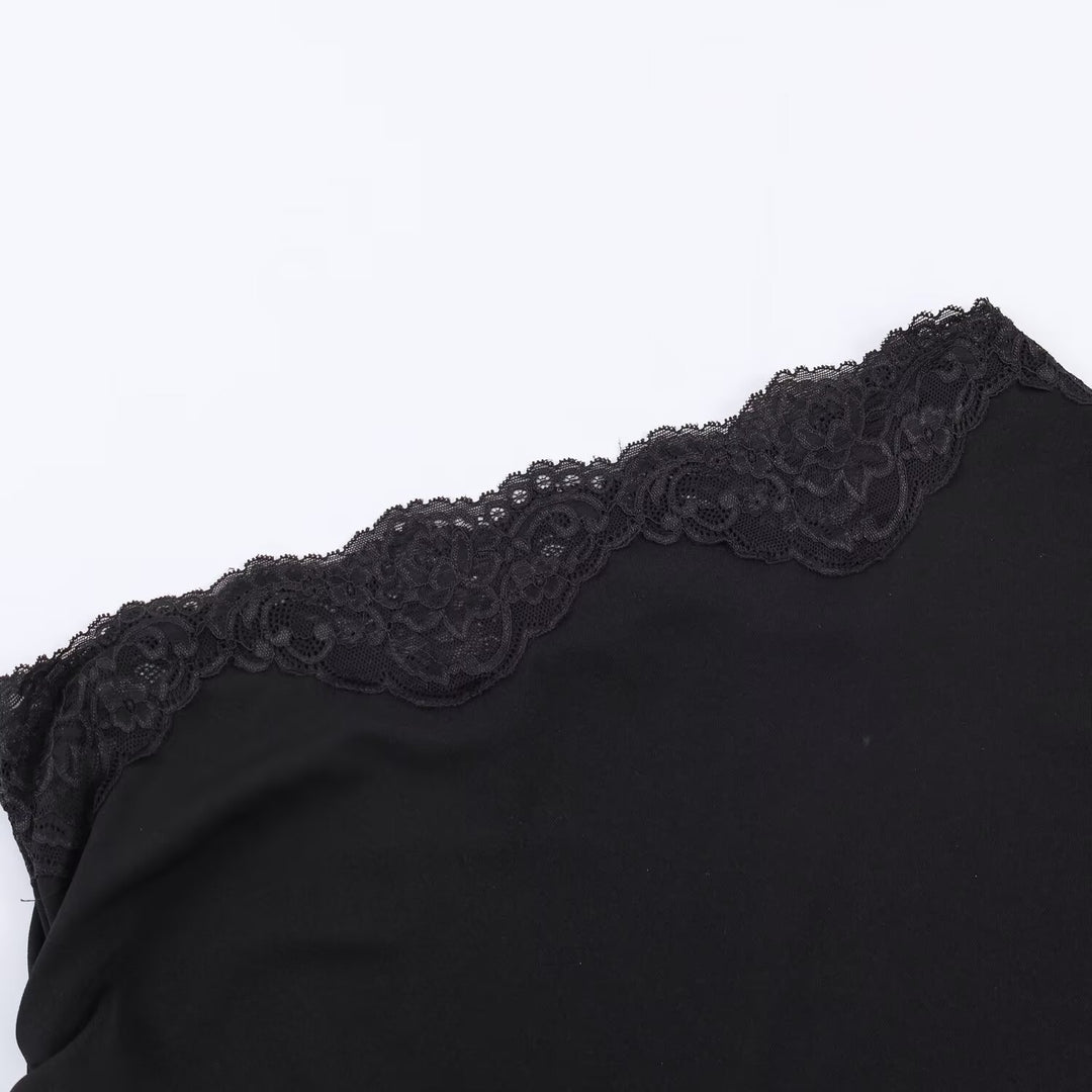 Damen asymmetrisk spetsoberdel med eleganta volangdetaljer Mirla-Eva Jonsson