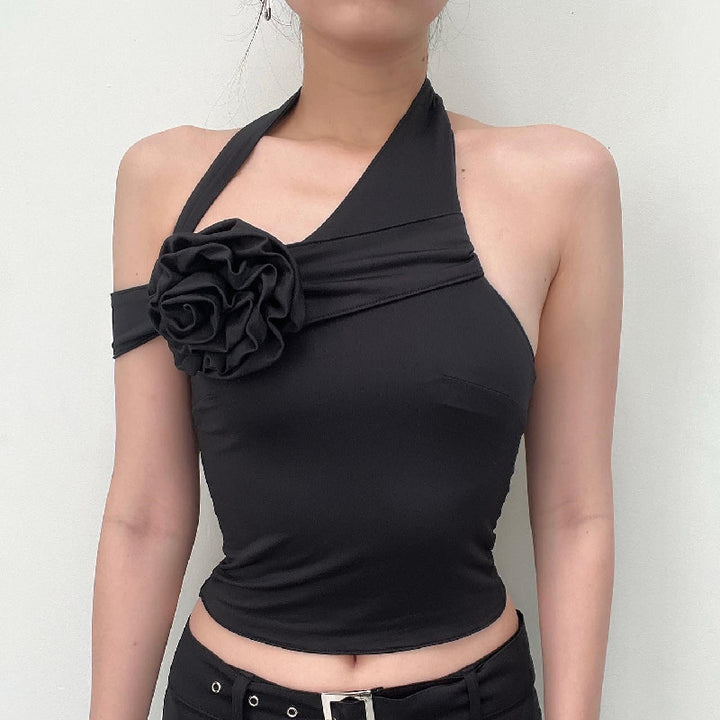 Damen asymmetrisk topp med floral applikation och justerbar rem Mirla-Eva Jonsson