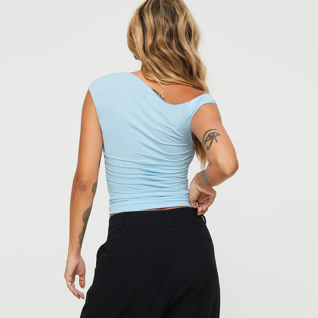 Damen asymmetriskt överdel med snyggt omslagsdesign Mirla-Eva Jonsson