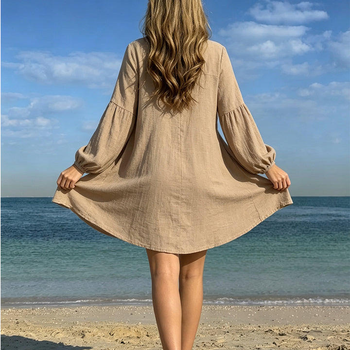 Damen avslappnad strandklänning med knappslå och ballongärmar Mirla-Eva Jonsson