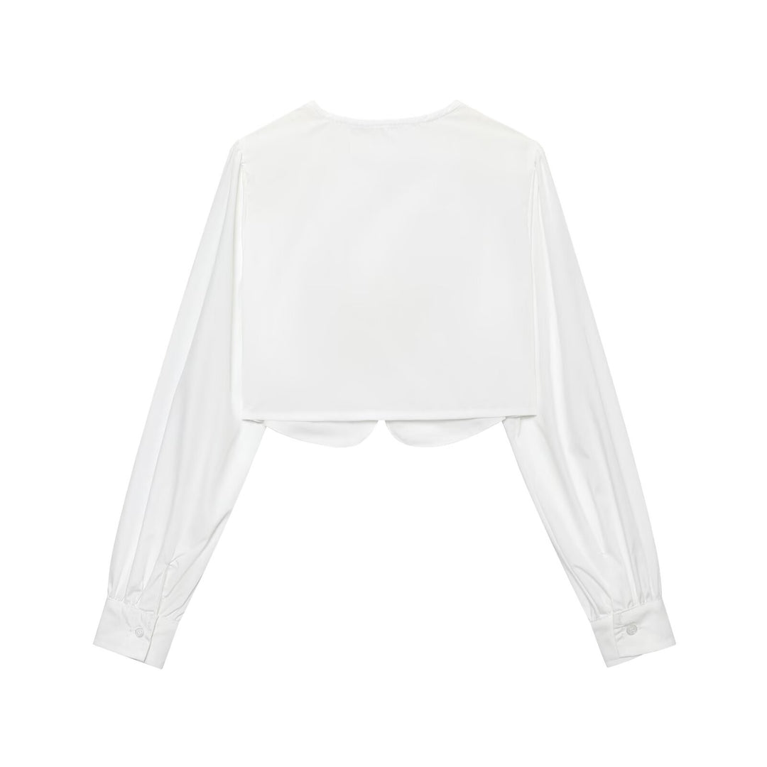 Damen cropped blus med långa puffiga ärmar och eleganta knapdetails Mirla-Eva Jonsson