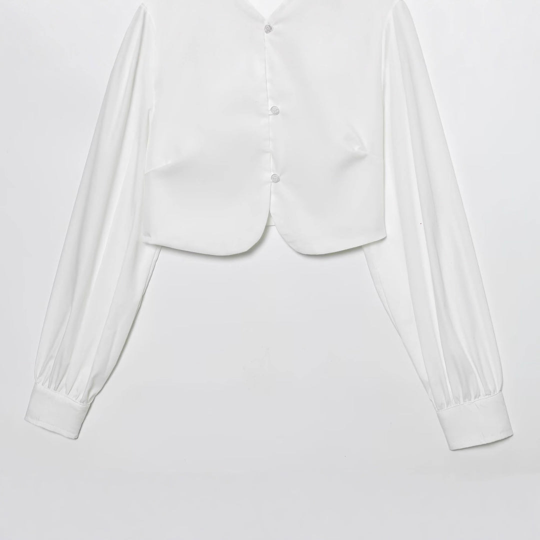 Damen cropped blus med långa puffiga ärmar och eleganta knapdetails Mirla-Eva Jonsson