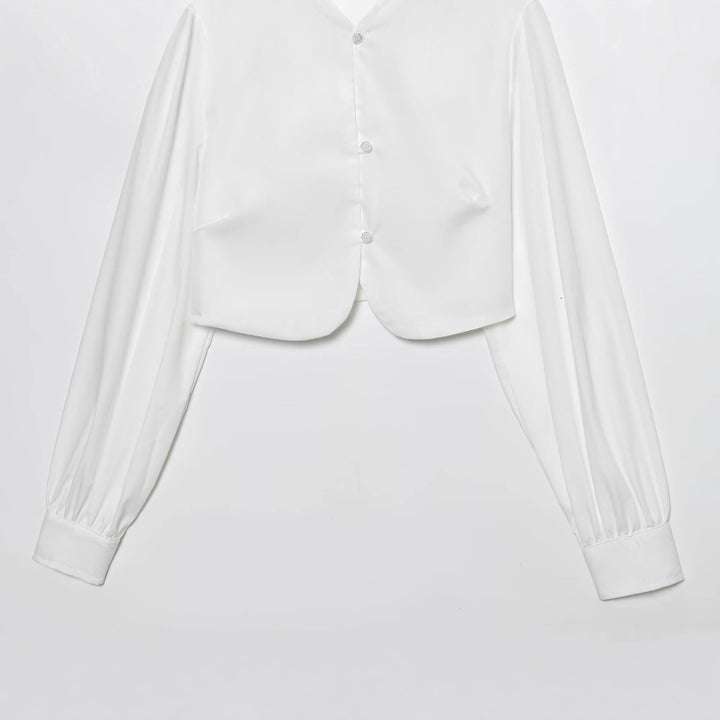 Damen cropped blus med långa puffiga ärmar och eleganta knapdetails Mirla-Eva Jonsson