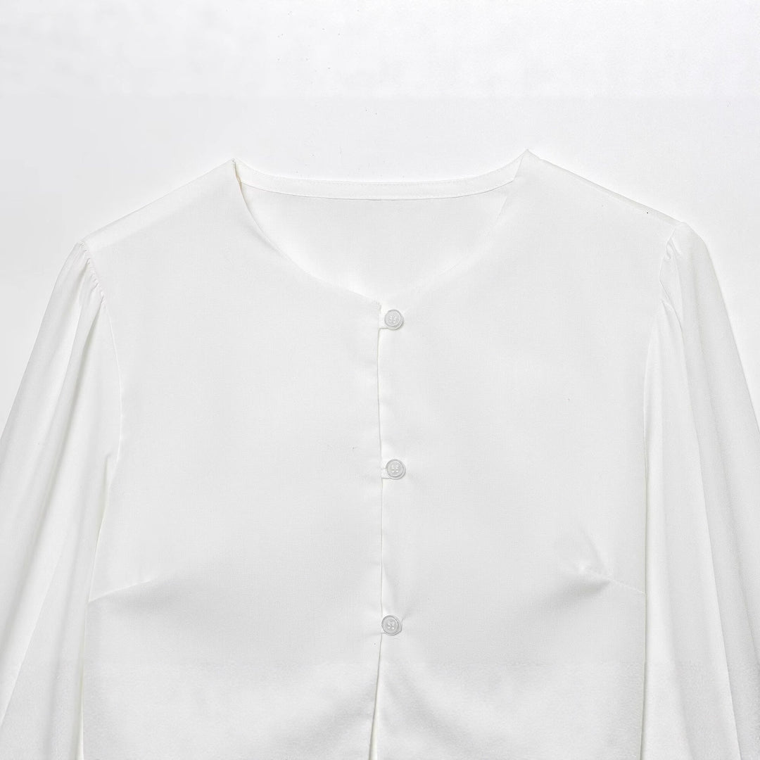 Damen cropped blus med långa puffiga ärmar och eleganta knapdetails Mirla-Eva Jonsson