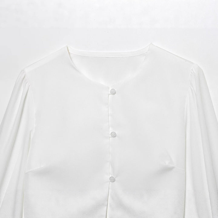 Damen cropped blus med långa puffiga ärmar och eleganta knapdetails Mirla-Eva Jonsson