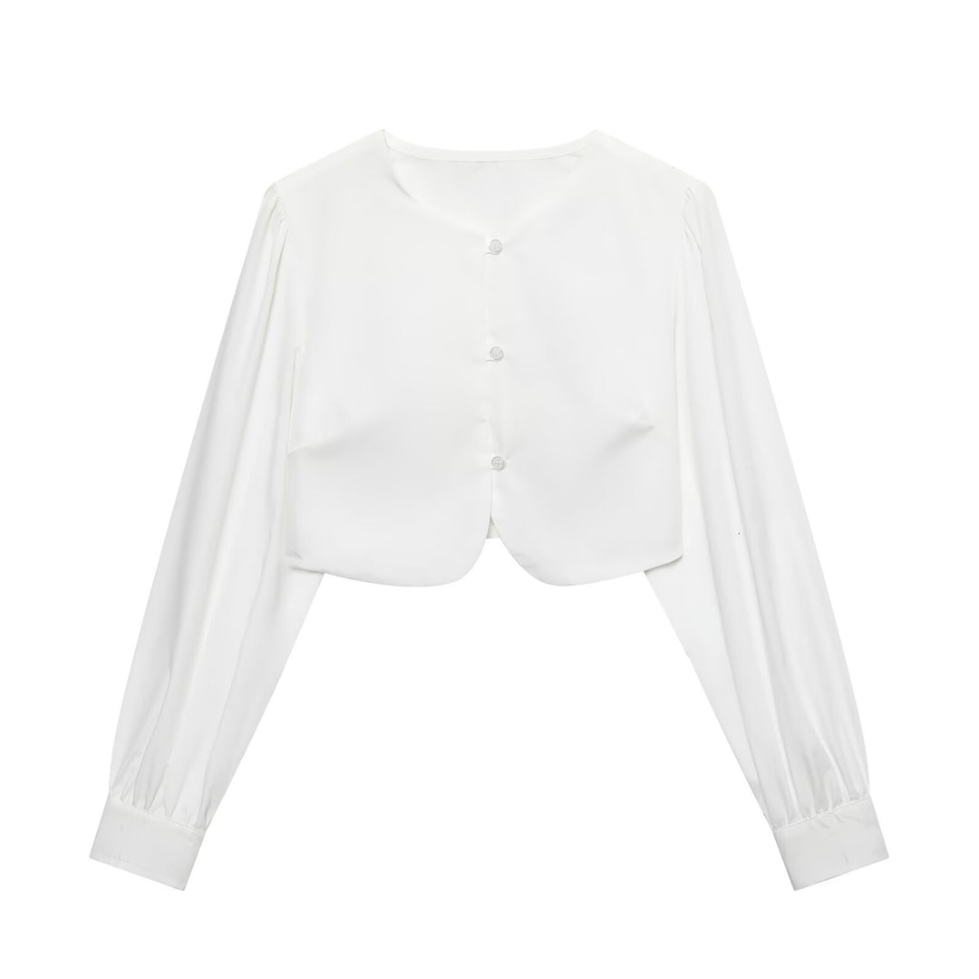 Damen cropped blus med långa puffiga ärmar och eleganta knapdetails Mirla-Eva Jonsson