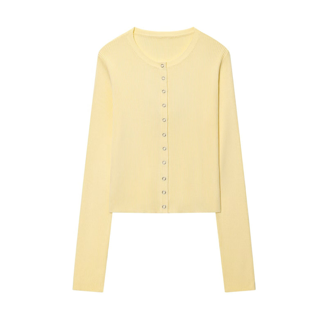Damen cropped långärmad tröja med knapppdetaljer och ribbad struktur Mirla-Eva Jonsson