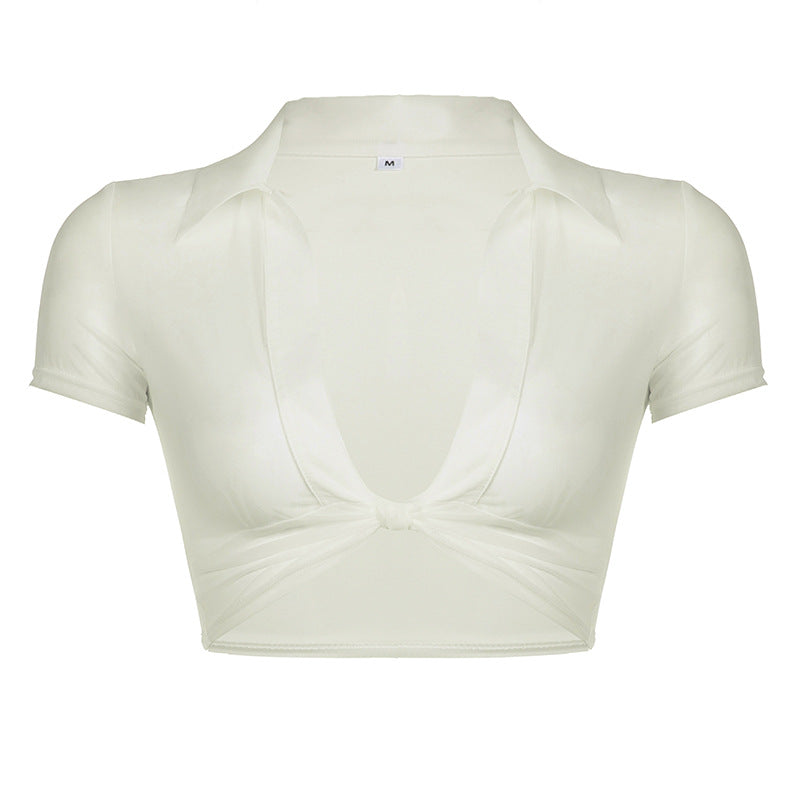Damen cropped topp med knutdesign och djup V-ringning Mirla-Eva Jonsson