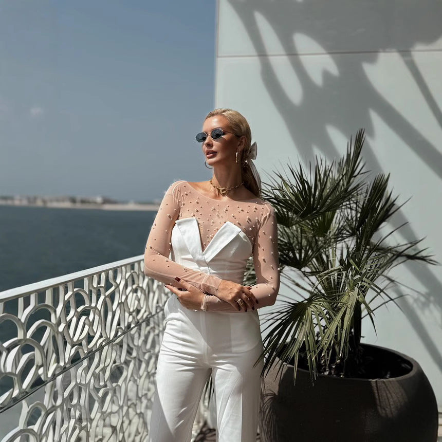 Damen elegant jumpsuit med genomskinliga ärmar och pärlprydnad Mirla-Eva Jonsson