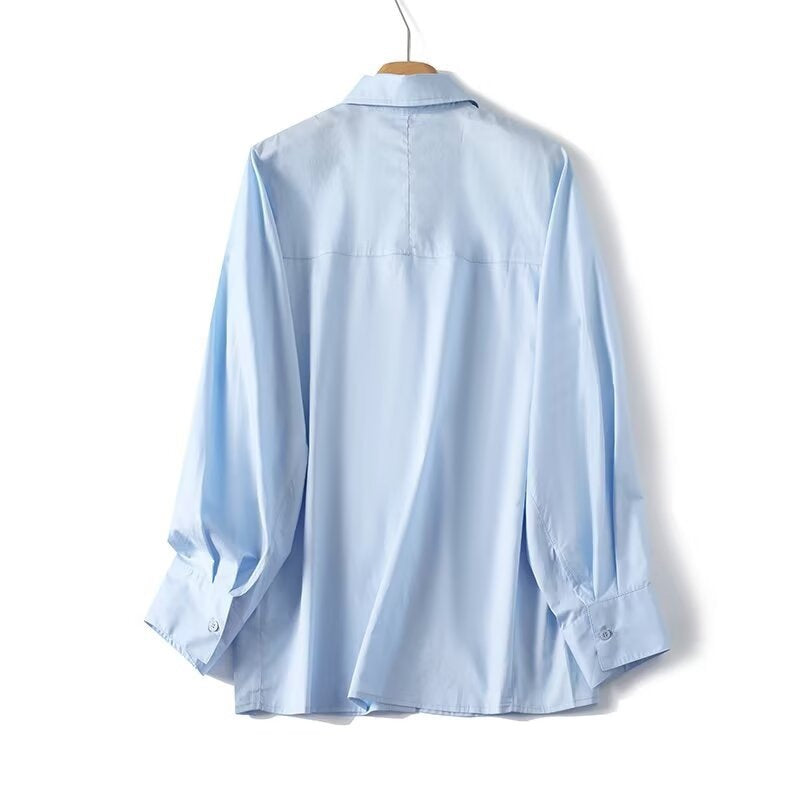 Damen elegant långärmad blus med moderna detaljer och strukturerad tyg Mirla-Eva Jonsson