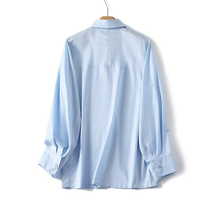 Damen elegant långärmad blus med moderna detaljer och strukturerad tyg Mirla-Eva Jonsson