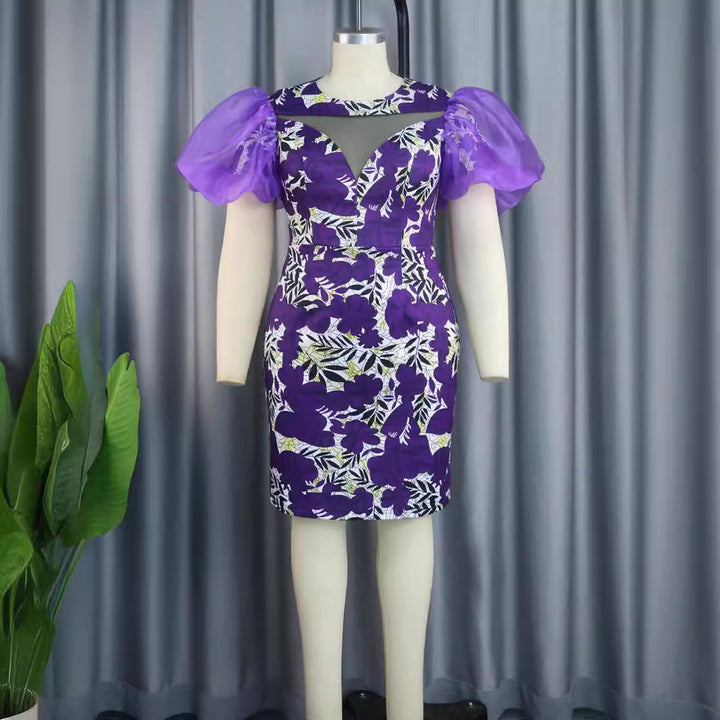 Damen extravagant cocktail dress with voluminous puff sleeves and floral pattern Mirla-Eva Jonsson