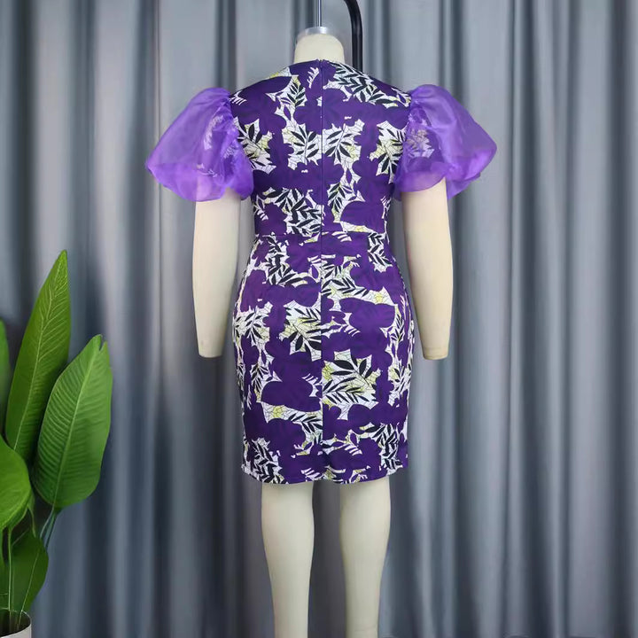 Damen extravagant cocktail dress with voluminous puff sleeves and floral pattern Mirla-Eva Jonsson