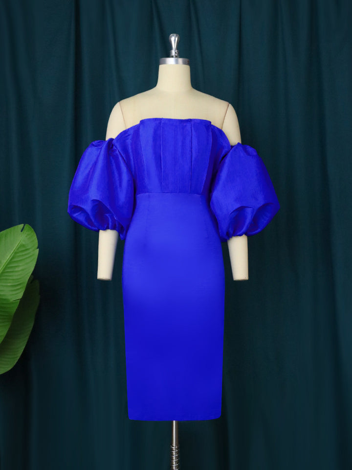 Damen figurnära klänning med off-shoulder design och voluminösa puffärmar Mirla-Eva Jonsson