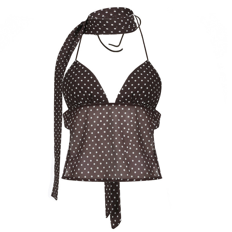 Damen halterneck top med lekfullt prickmönster och eleganta knytband Mirla-Eva Jonsson