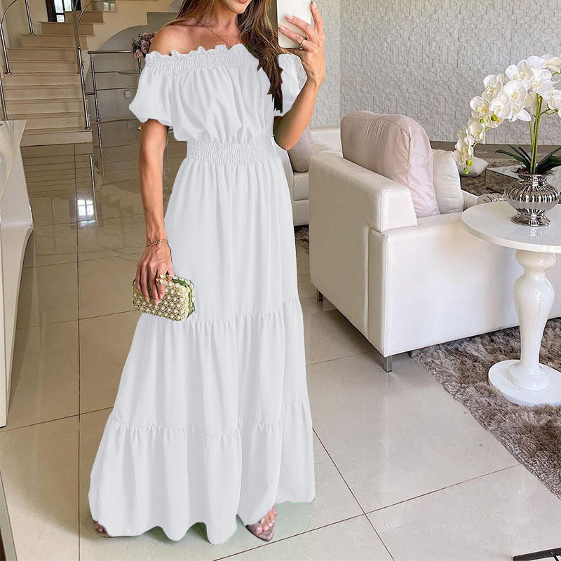 Damen maxiklänning med axelbörjad design och voluminösa ruffle detaljer Mirla-Eva Jonsson