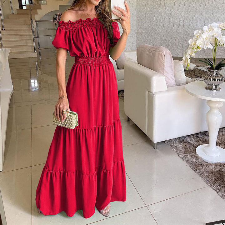 Damen maxiklänning med axelbörjad design och voluminösa ruffle detaljer Mirla-Eva Jonsson