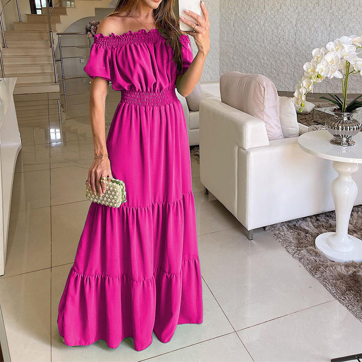 Damen maxiklänning med axelbörjad design och voluminösa ruffle detaljer Mirla-Eva Jonsson