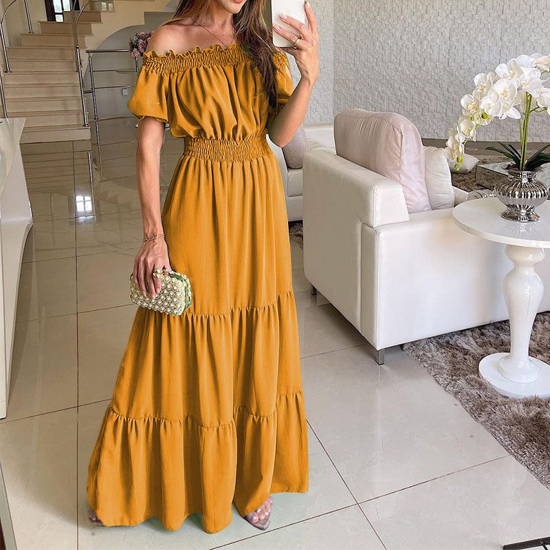 Damen maxiklänning med axelbörjad design och voluminösa ruffle detaljer Mirla-Eva Jonsson