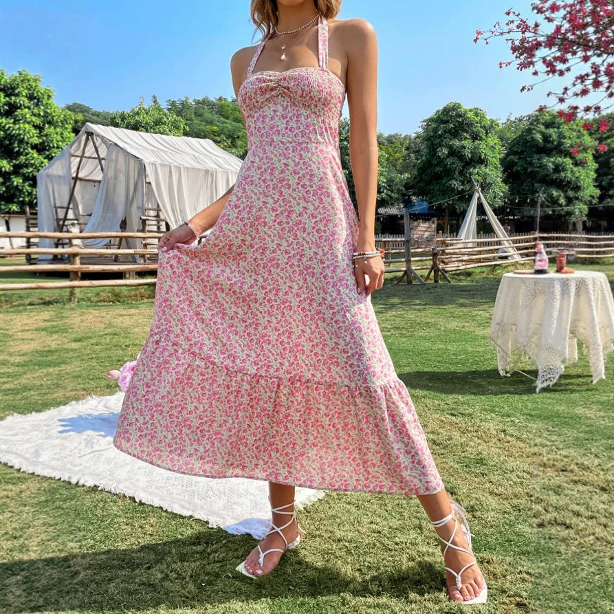 Damen maxiklänning med blommig design och rynkad fåll Mirla-Eva Jonsson