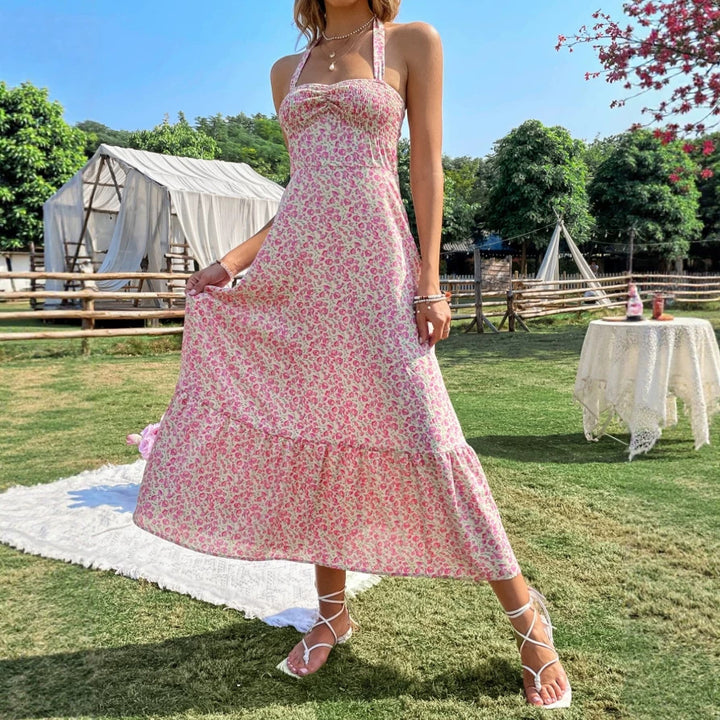 Damen maxiklänning med blommig design och rynkad fåll Mirla-Eva Jonsson