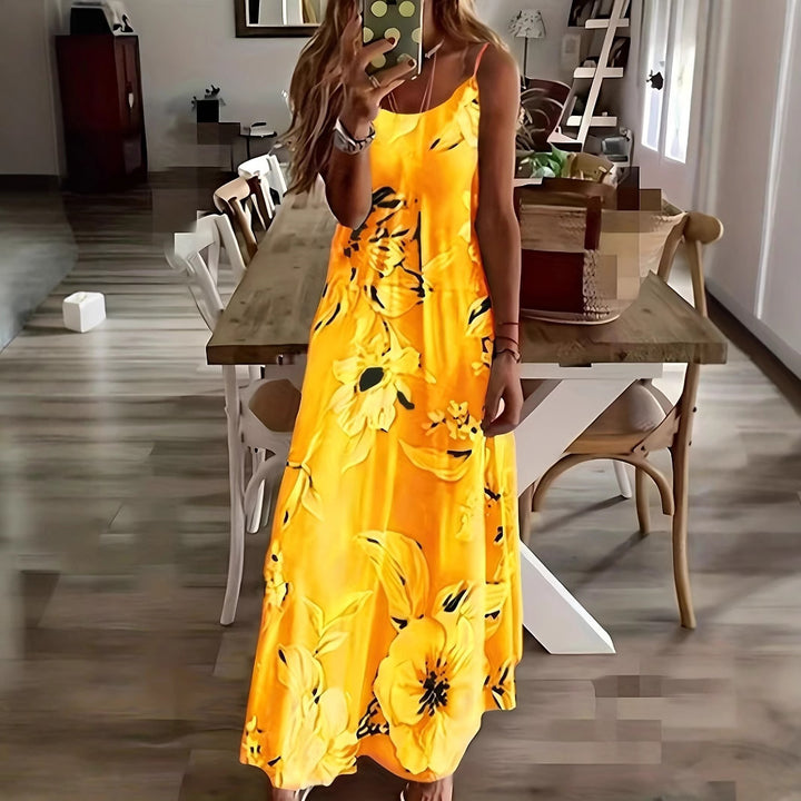Damen maxiklänning med blommigt mönster och diskret halsringning Mirla-Eva Jonsson