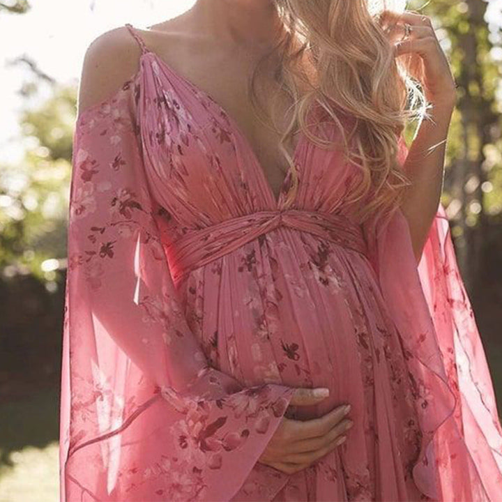 Damen maxiklänning med eleganta trumpetärmar och blommönstrat övermaterial Mirla-Eva Jonsson