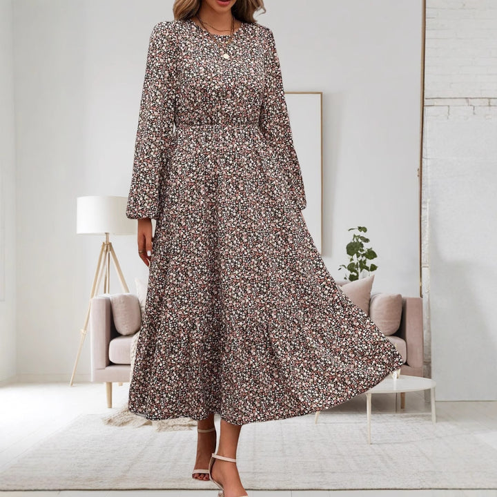 Damen midi-klänning med elastiskt midjeband och blommönster Mirla-Eva Jonsson