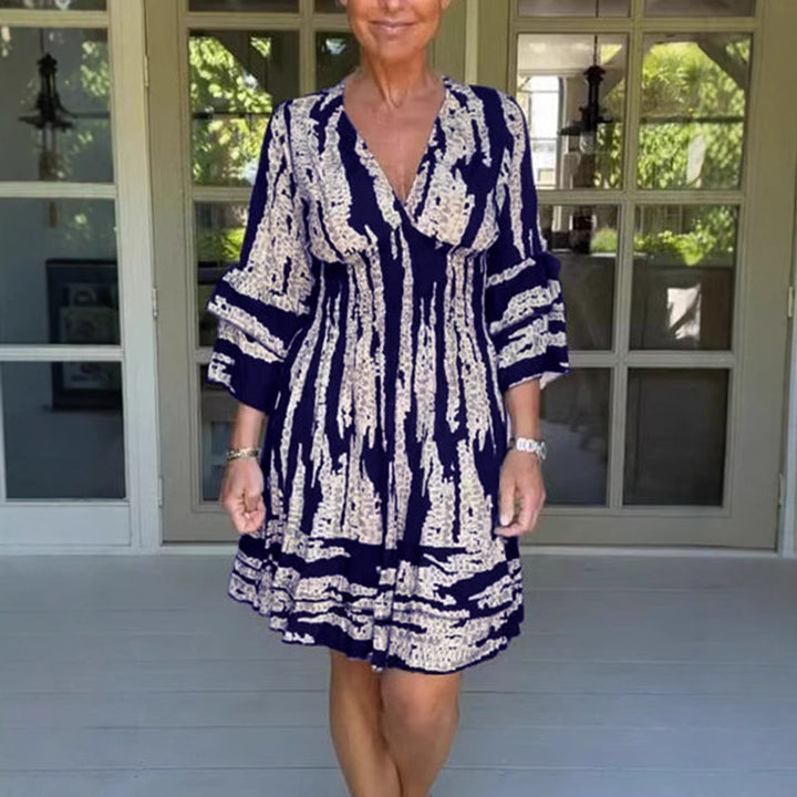 Damen midikjol med lekfullt mönster och eleganta 3/4-ärmar Mirla-Eva Jonsson