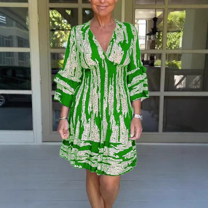 Damen midikjol med lekfullt mönster och eleganta 3/4-ärmar Mirla-Eva Jonsson