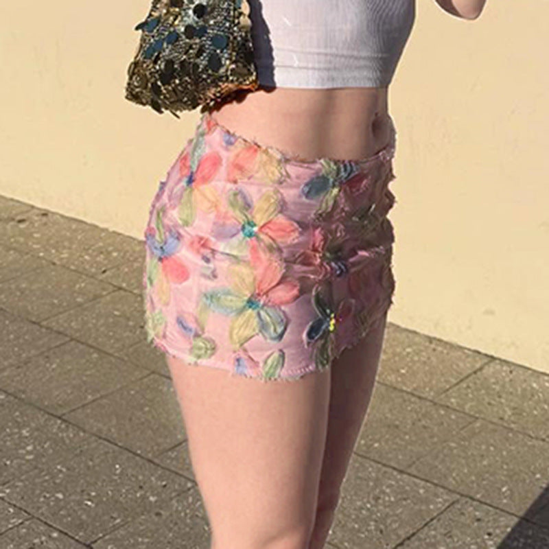 Damen minikjol med blommig 3D-design och glittrande accenter Mirla-Eva Jonsson