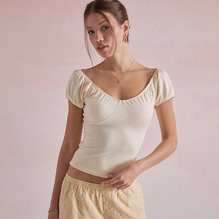 Damen mode top med puffärmar och figursydd silhuett Mirla-Eva Jonsson