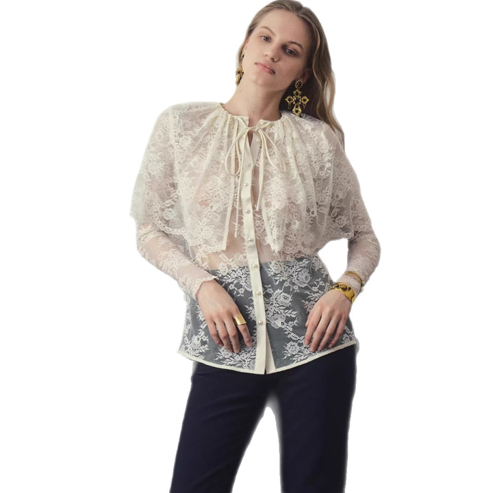 Damen spitzenblus med elegant slinga dekoration och transparenta insatser Mirla-Eva Jonsson