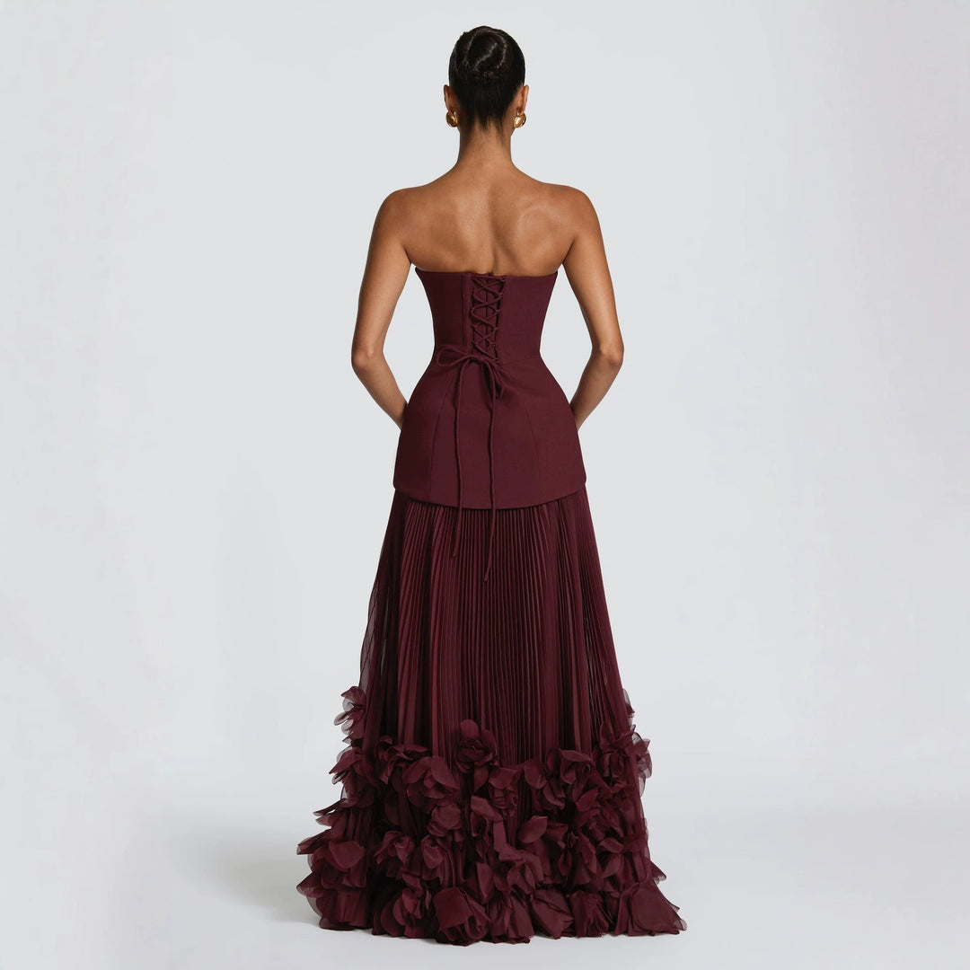 Damen strapless maxikjol med flytande kjol och blommig detalj Mirla-Eva Jonsson