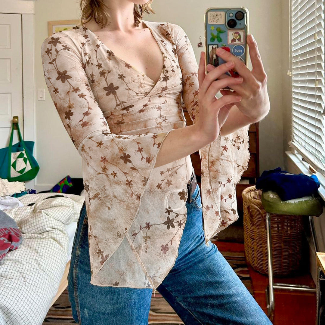 Damen wrap top med voluminösa ärmar och blommig tryck Mirla-Eva Jonsson